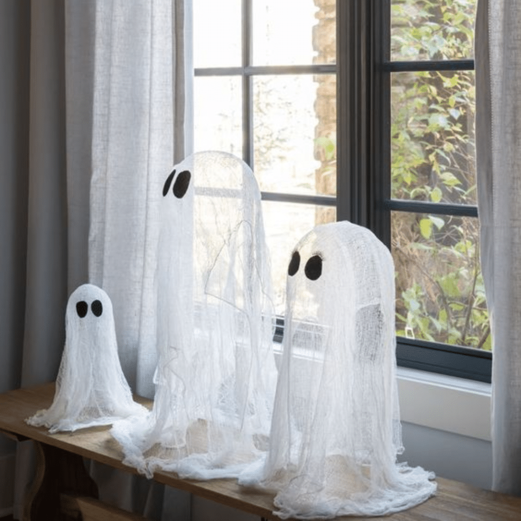 DIY Cheesecloth ghosts on windowsill for fall season